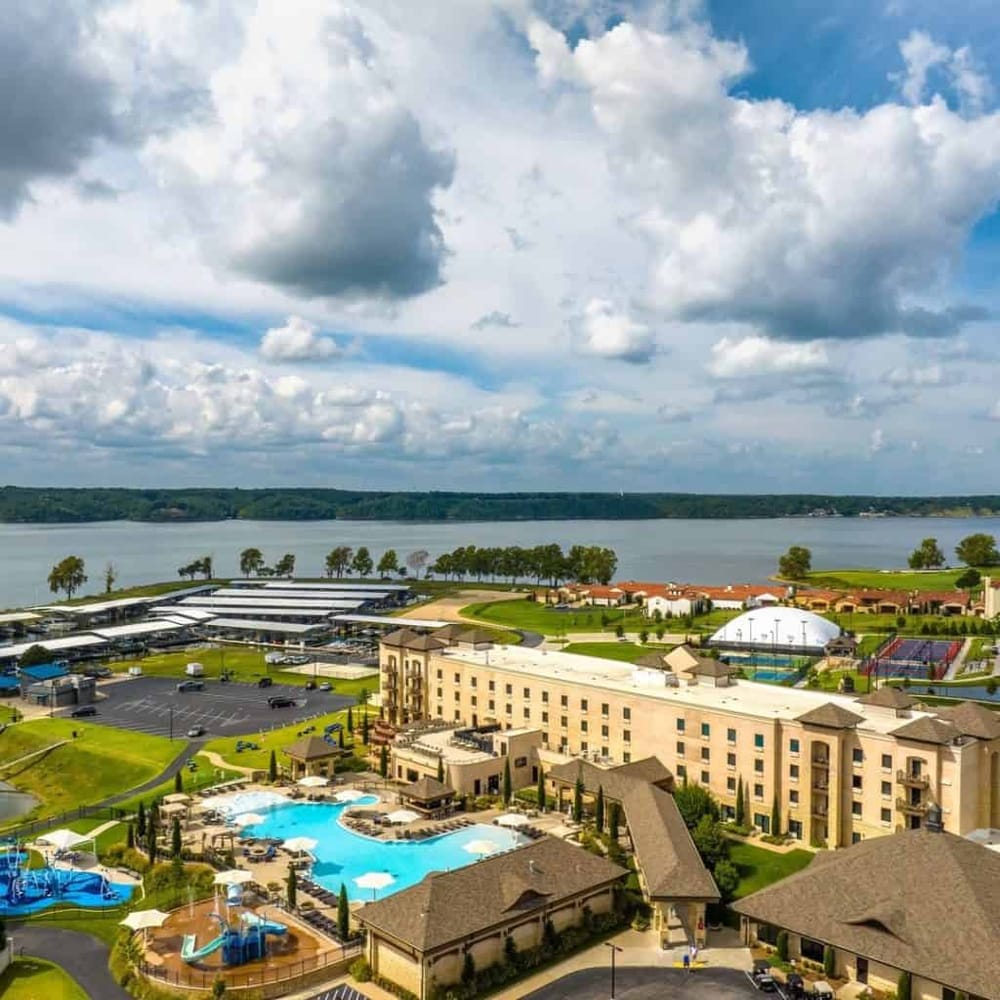 Resort with pool, lake view, and outdoor amenities at Quest for Directions. Ideal for relaxing and outdoor activities.