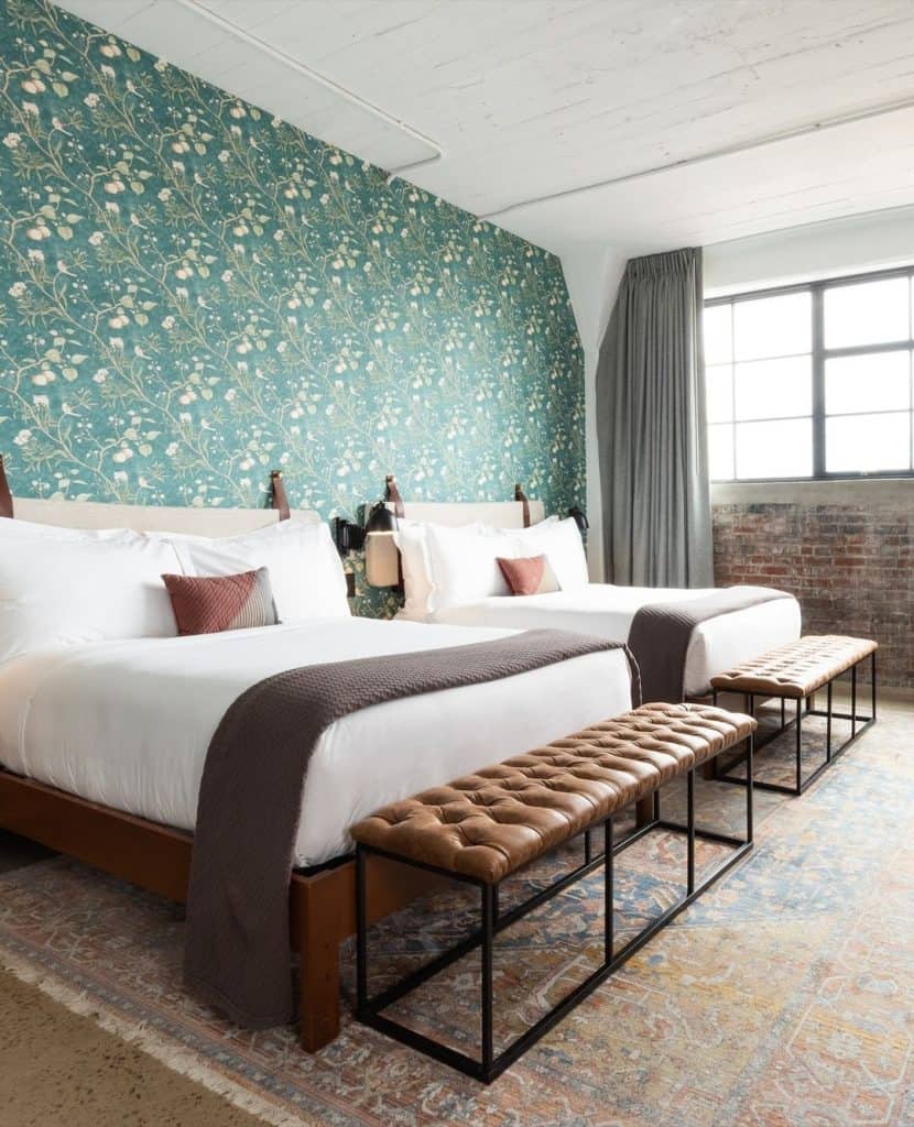 Modern hotel room with stylish decor and comfortable beds, perfect for relaxing stays.