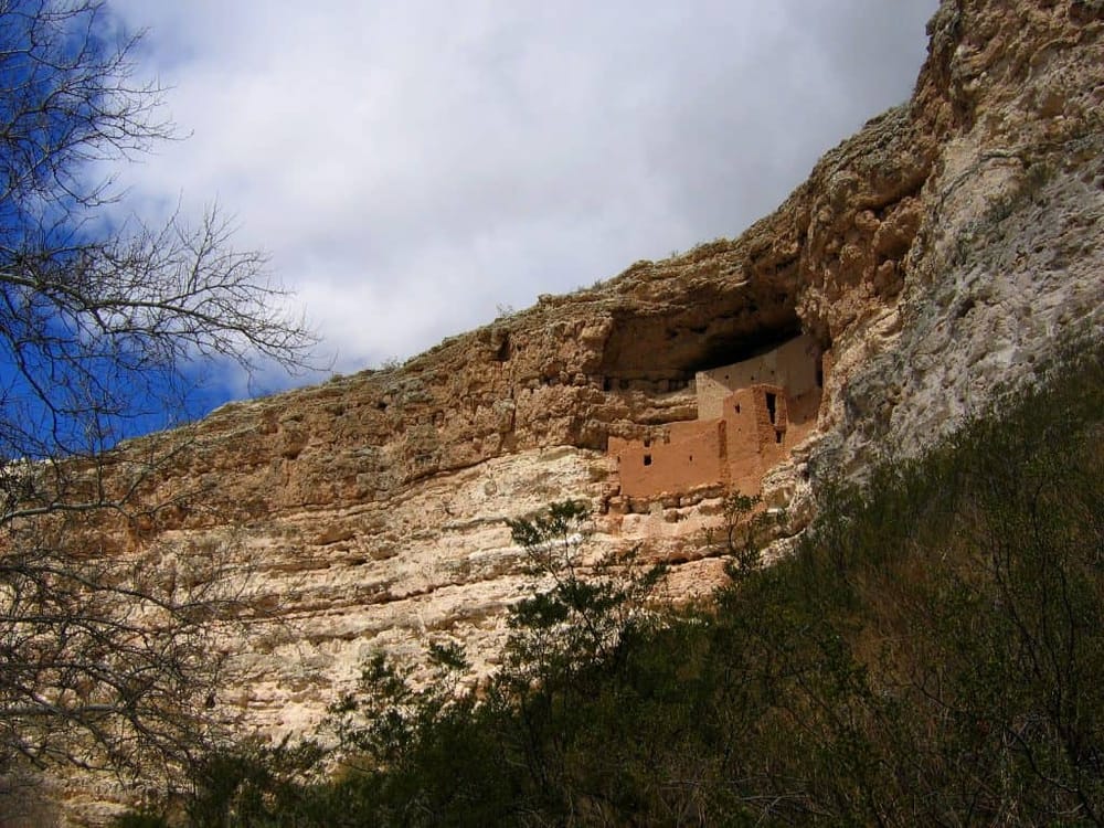 Ancient cliff dwelling adobe house built into a rocky cliff, part of Native American history.