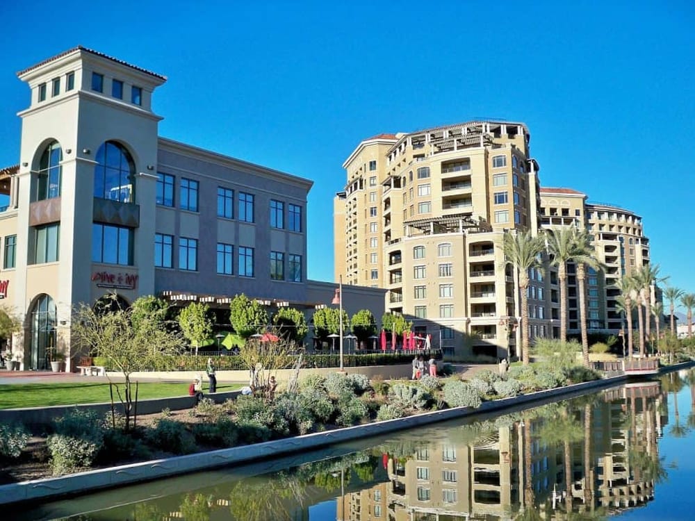 Modern Urban Residential Buildings with Shops and Water Feature in Downtown Area.