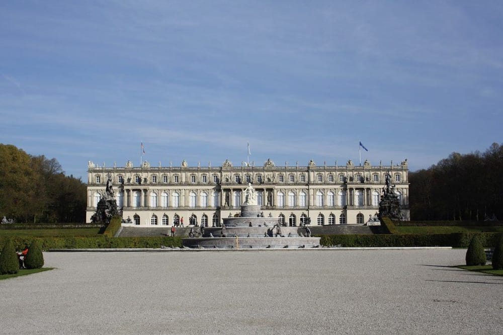 Luxurious European palace with ornate architecture and beautiful gardens, perfect for travel and sightseeing.