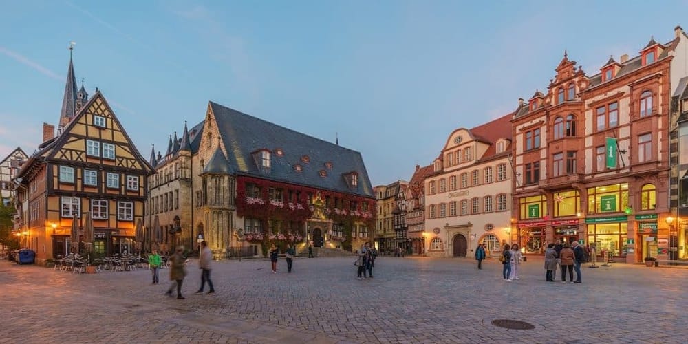 Charming European town square with historic buildings, cobblestone streets, and vibrant nightlife scenes.