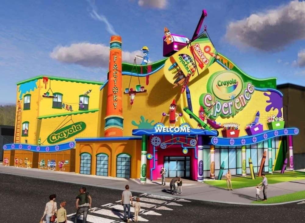 Colorful Crayola Experience building with large Crayola logo, kids, and families outside, vibrant arts and crafts attractions, creative fun, and interactive activities.