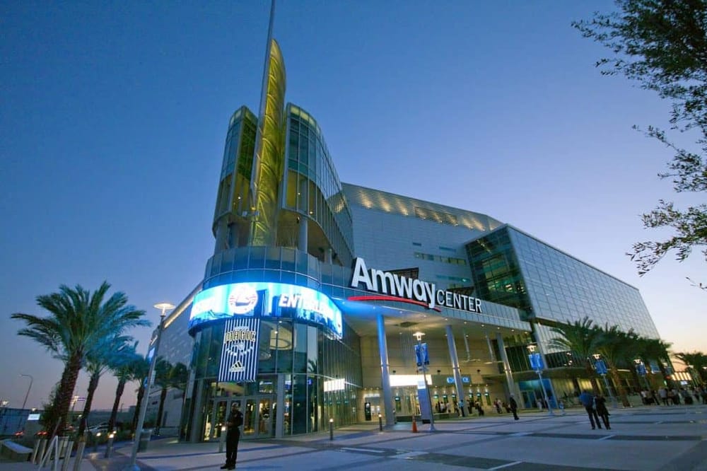 Modern Amway Center with glass facade and LED signage, located in Orlando, Florida.