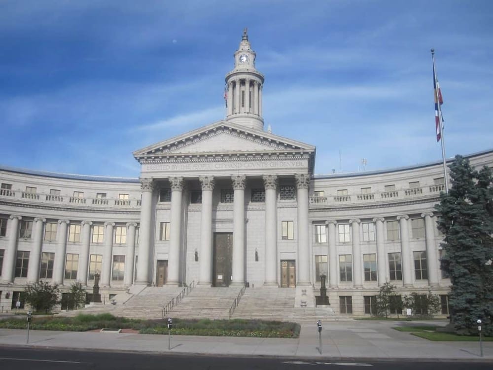 Grand County Courthouse in Denver, Colorado, showcasing neoclassical architecture with columns and a clock tower.