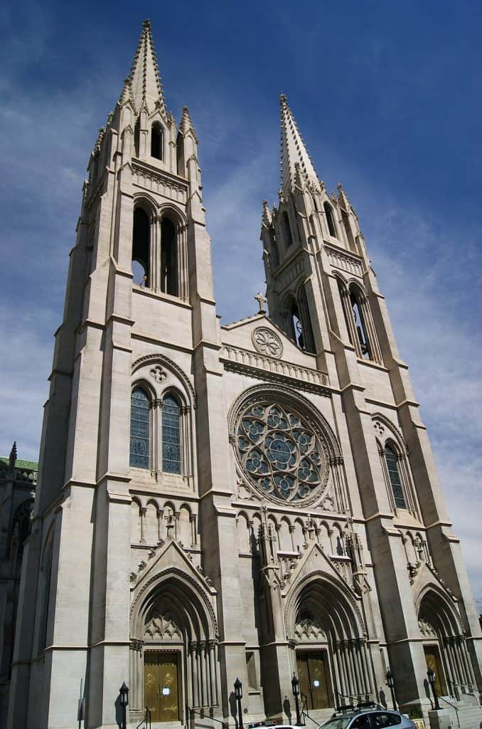 Elegant Gothic-style cathedral with twin spires and intricate stone carvings, a stunning landmark.