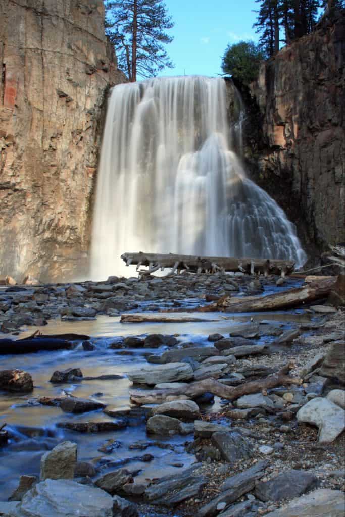 Serene waterfall streaming down rocky cliff at Yosemite National Park, California.