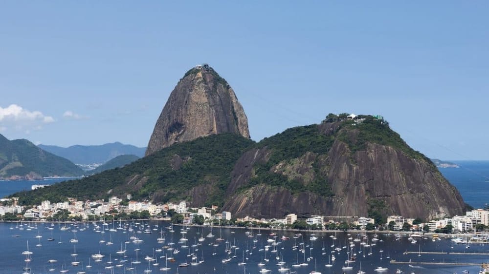 Iconic Sugarloaf Mountain with cityscape and marina in Rio de Janeiro, Brazil, famous travel destination.