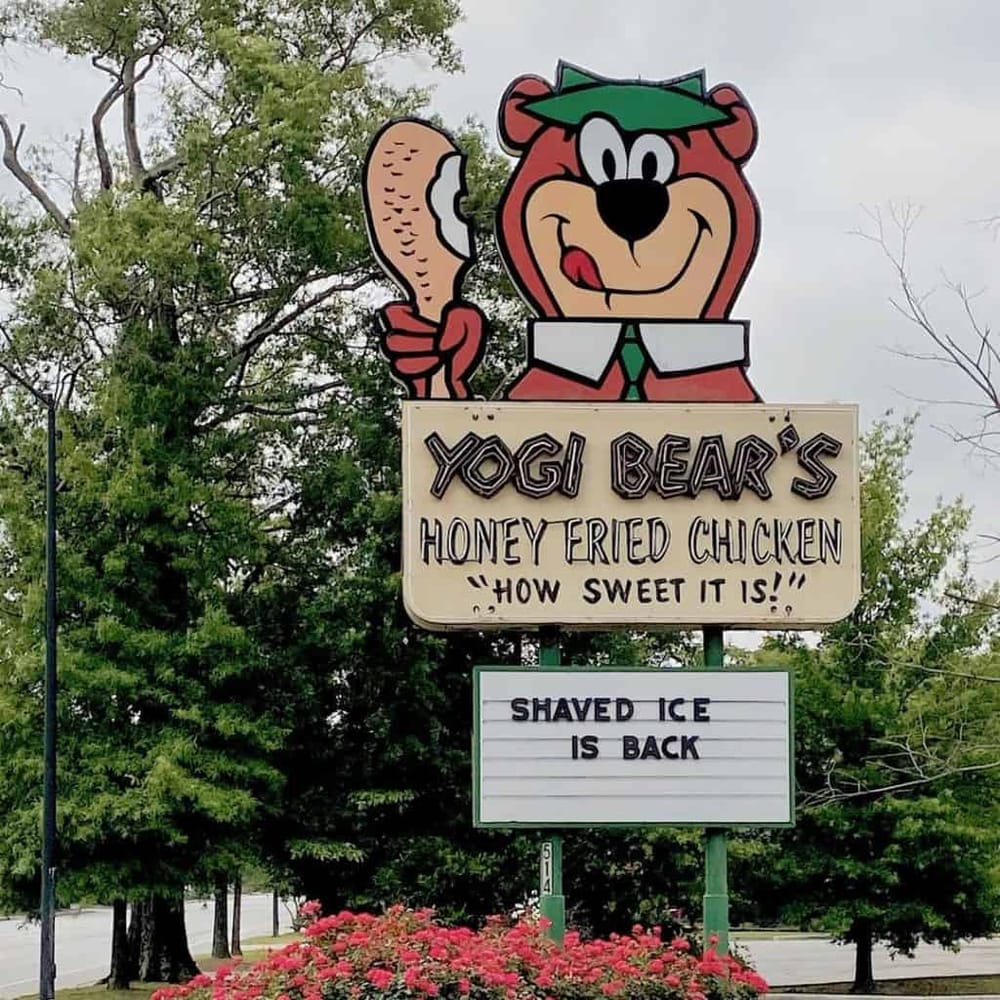 Yogi Bear's Honey Fried Chicken sign, Yogi Bear mascot promoting fried chicken and shaved ice.