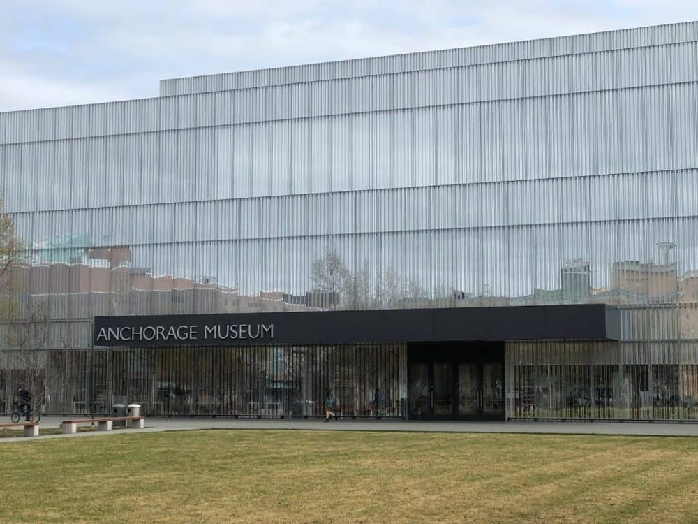 Modern Anchorage Museum building with sleek metal exterior and glass entrance in Alaska.