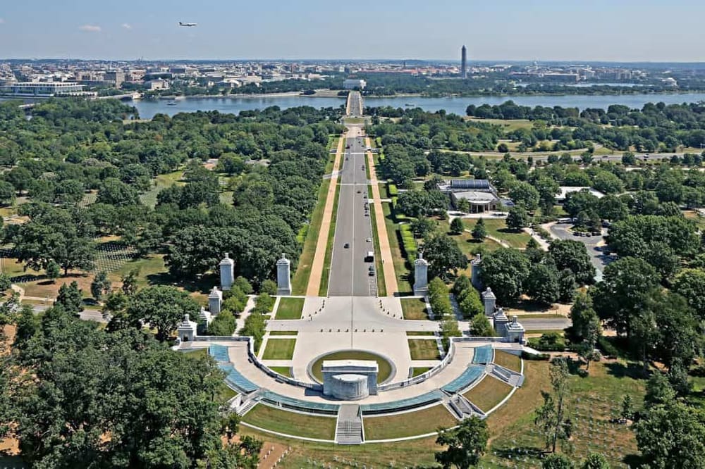 Aerial view of a city park with monuments, water, and skyline, highlighting scenic outdoor spaces and urban greenery.