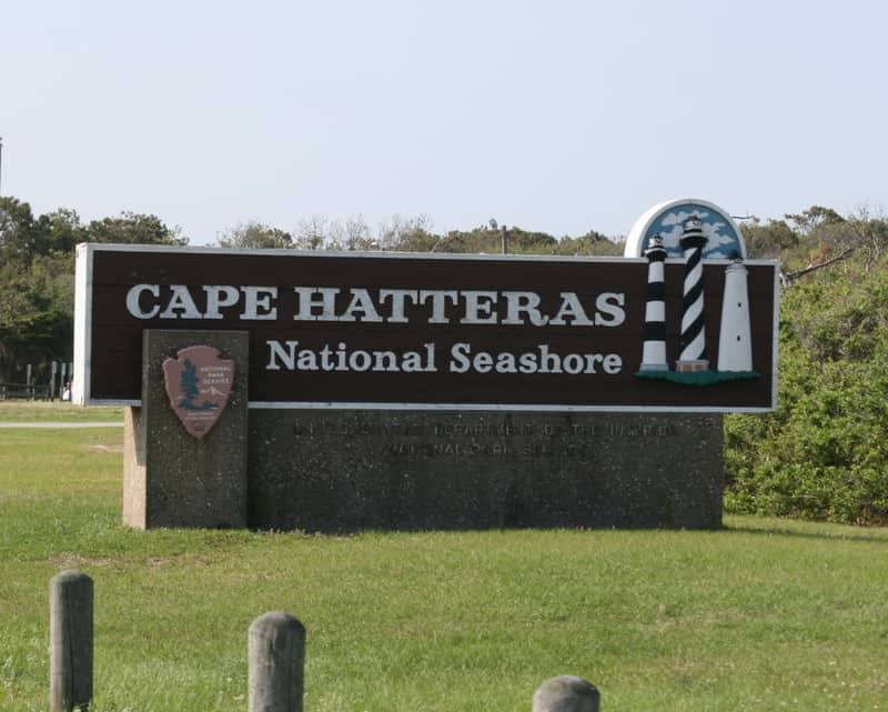 Scenic Cape Hatteras National Seashore sign at beach entrance in North Carolina.