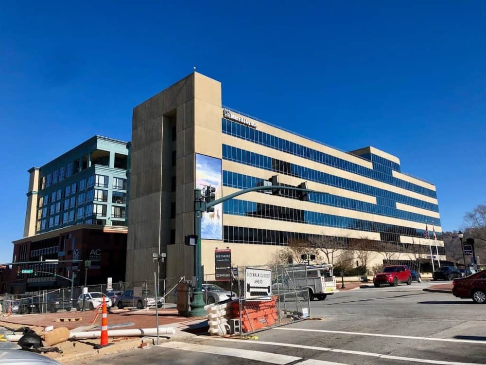 Modern downtown office building with glass facade, part of QuestForDirections business prominence.