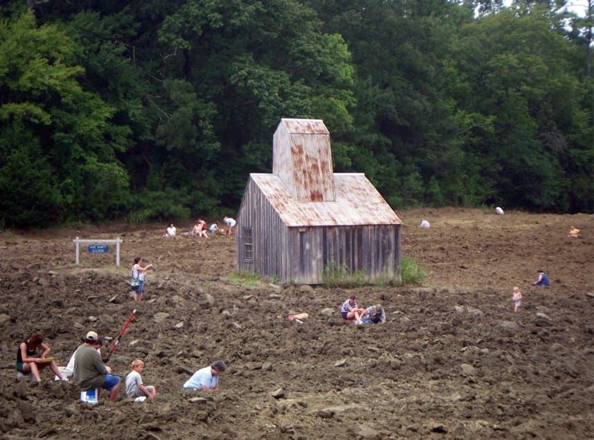 Rural wooden barn in field with people exploring and fishing, nature scenery, family outdoor activity, QuestForDirections.