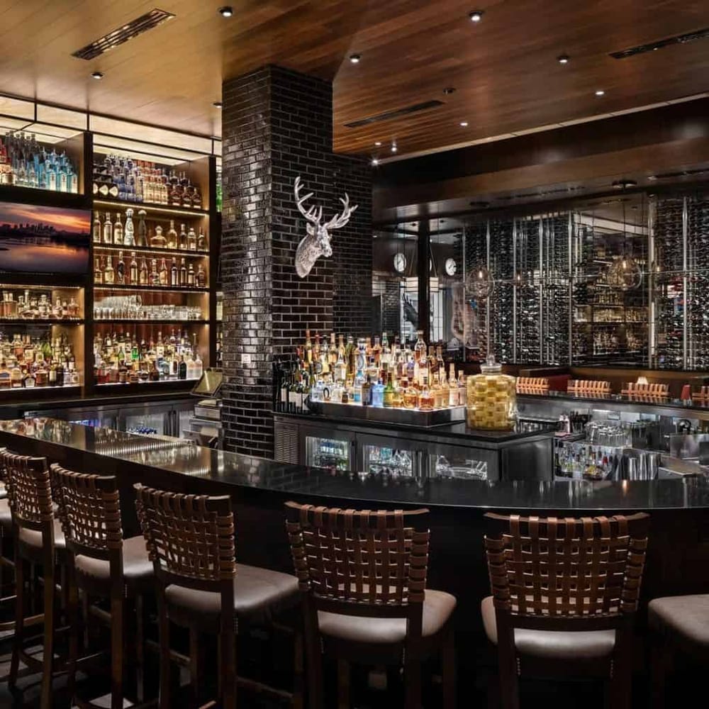 Stylish modern bar with a wide selection of spirits and a sleek, inviting interior. Perfect for socializing and nightlife dining.