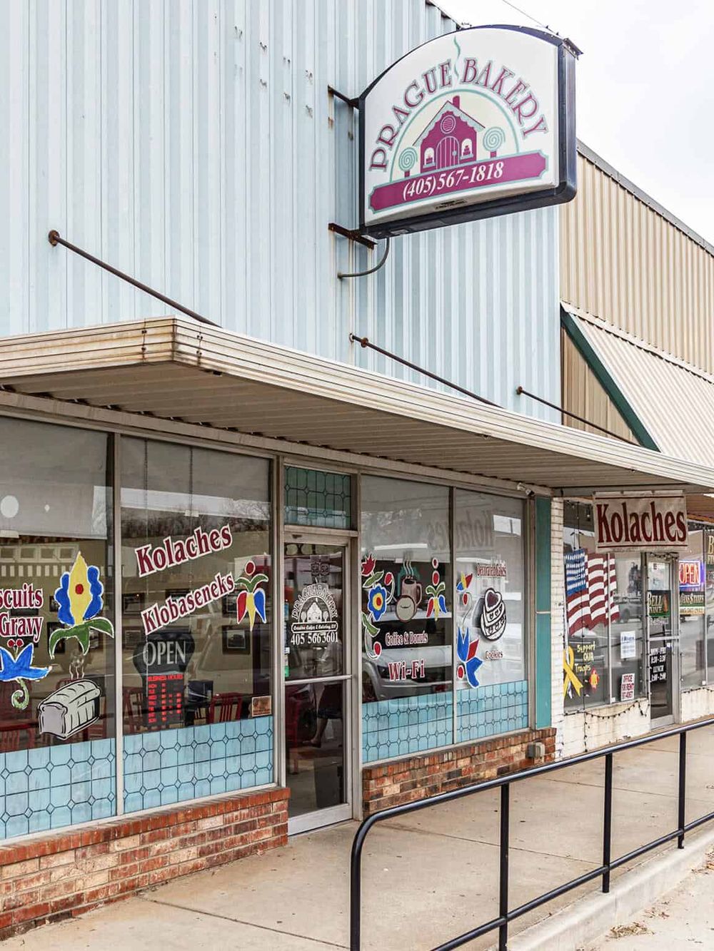 Authentic bakery storefront with colorful decals and signage in Oklahoma.