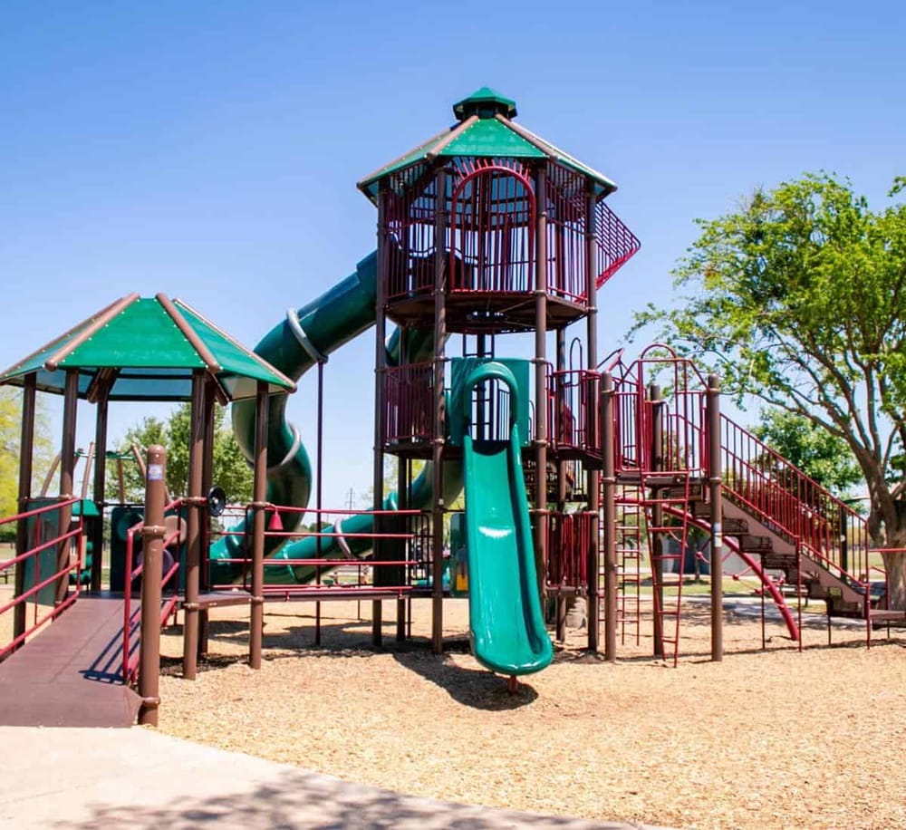 Colorful playground slide structure for kids at QuestForDirections park.
