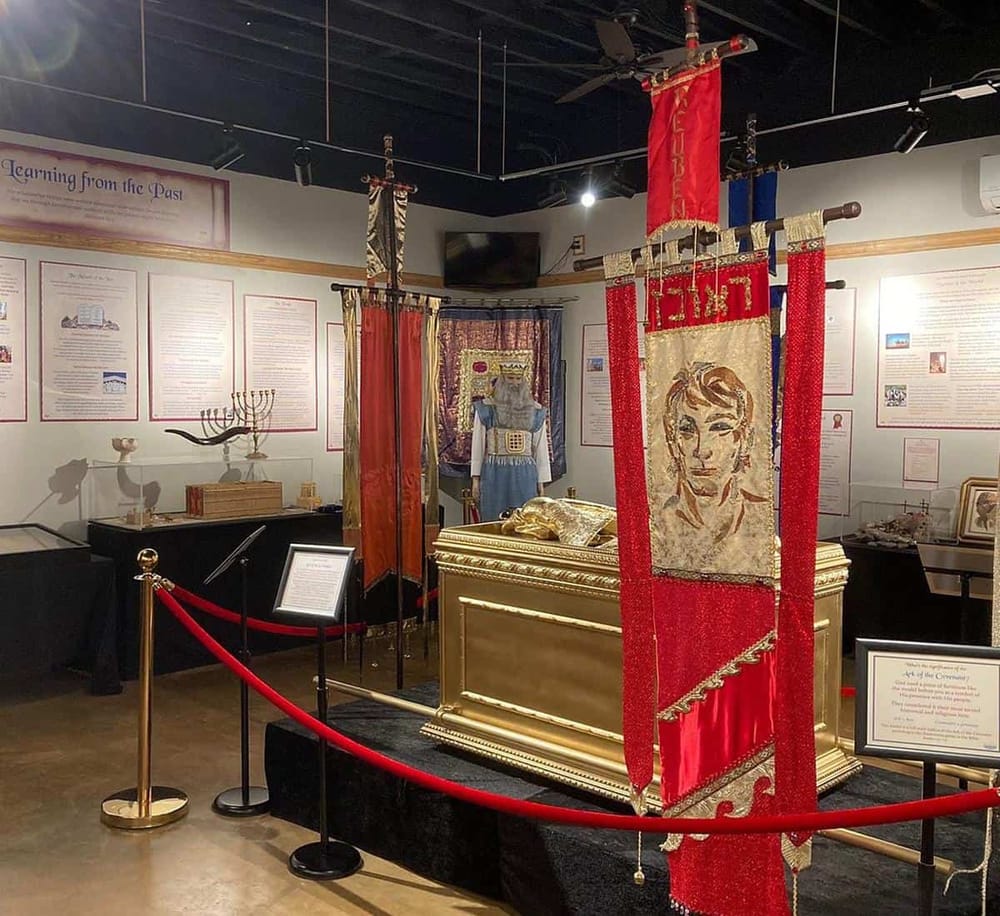 Colorful ceremonial artifacts and historical exhibits in a museum display.