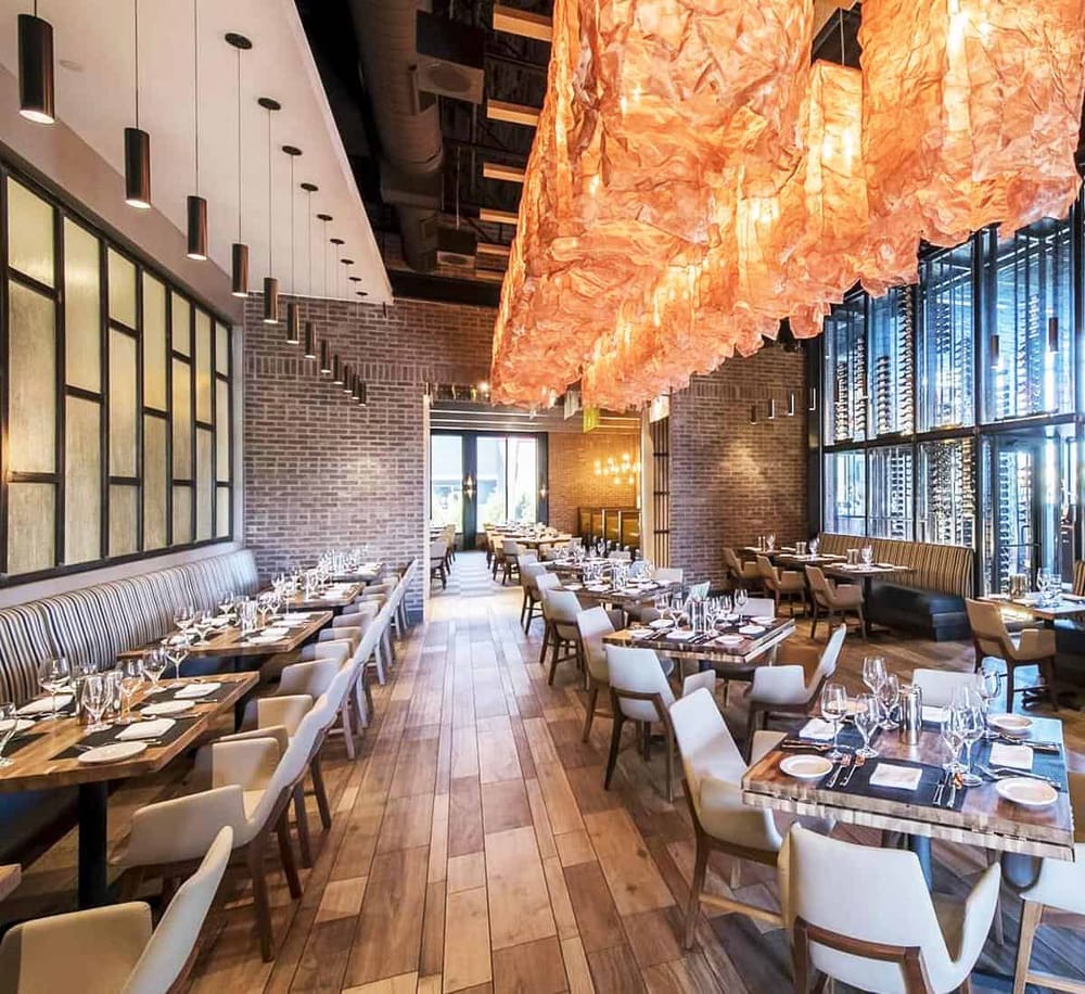 Stylish modern restaurant interior with warm lighting and contemporary decor for upscale dining.
