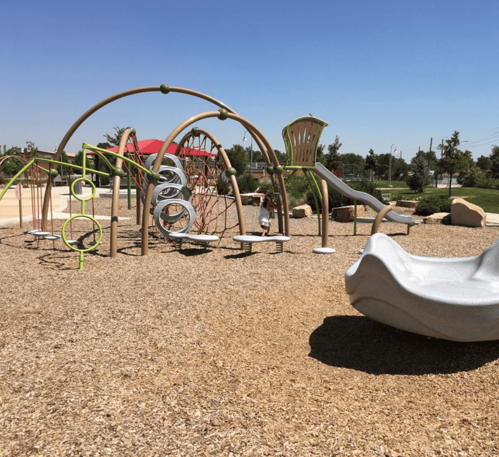 Colorful playground equipment for kids at a modern outdoor park.
