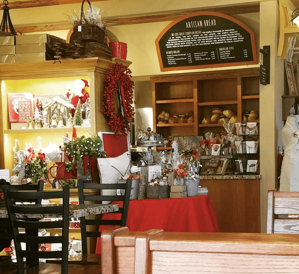 Cozy bakery interior with holiday decor and assorted baked goods, ideal for exploring baking and pastry options.