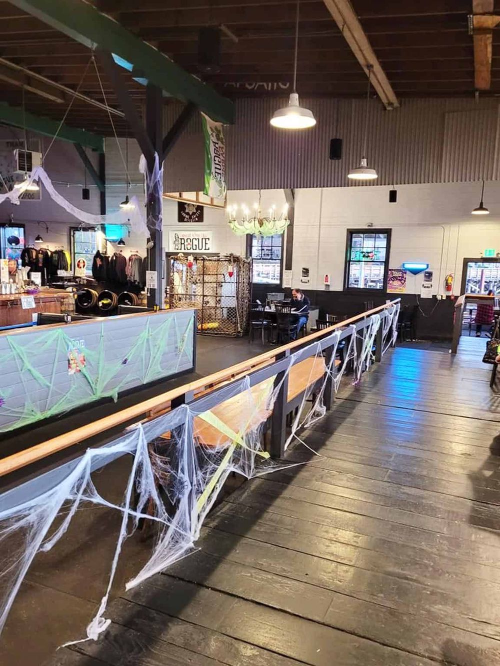 Spooky Halloween-themed interior with cobwebs and festive decorations at QuestForDirections.