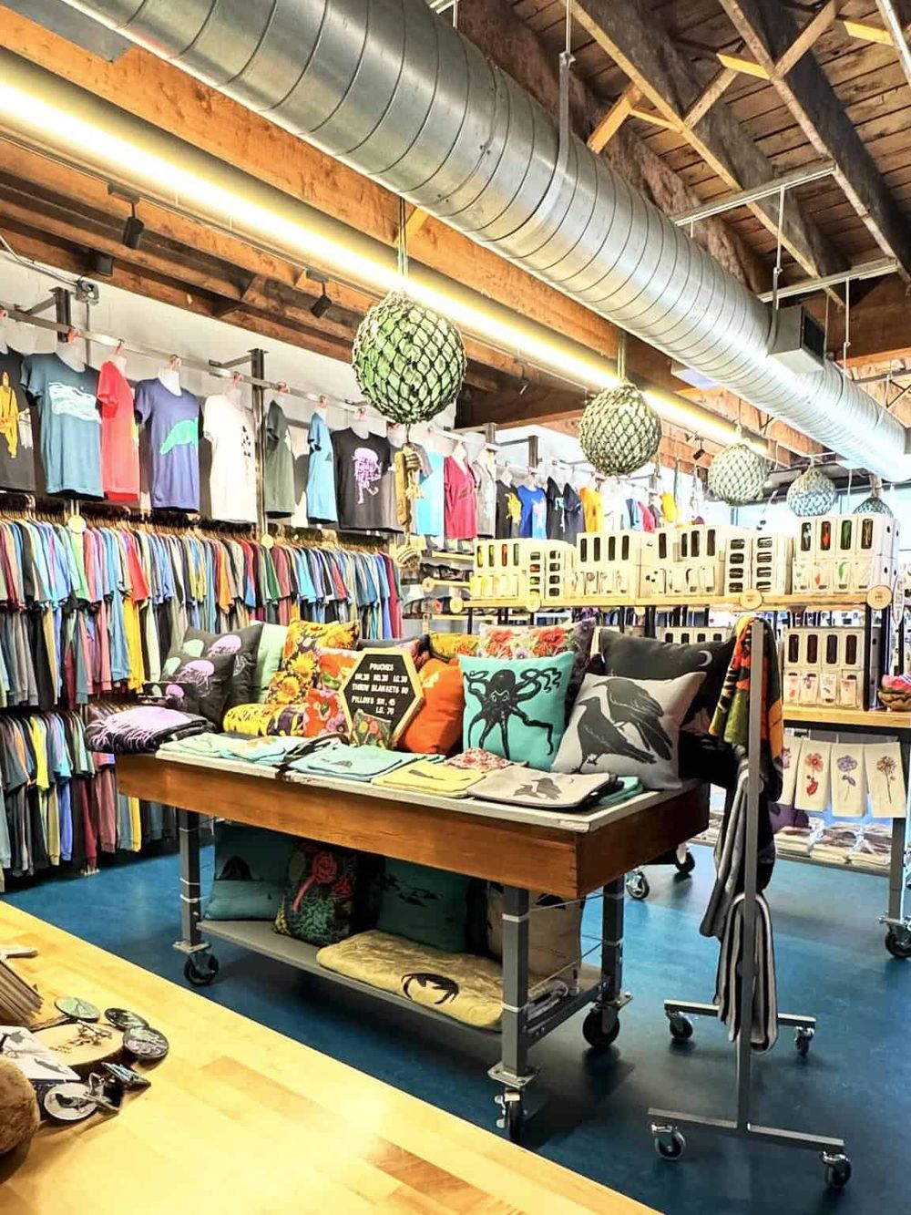 Colorful clothing and accessories display at a trendy retail store, highlighting shopping and fashion options.