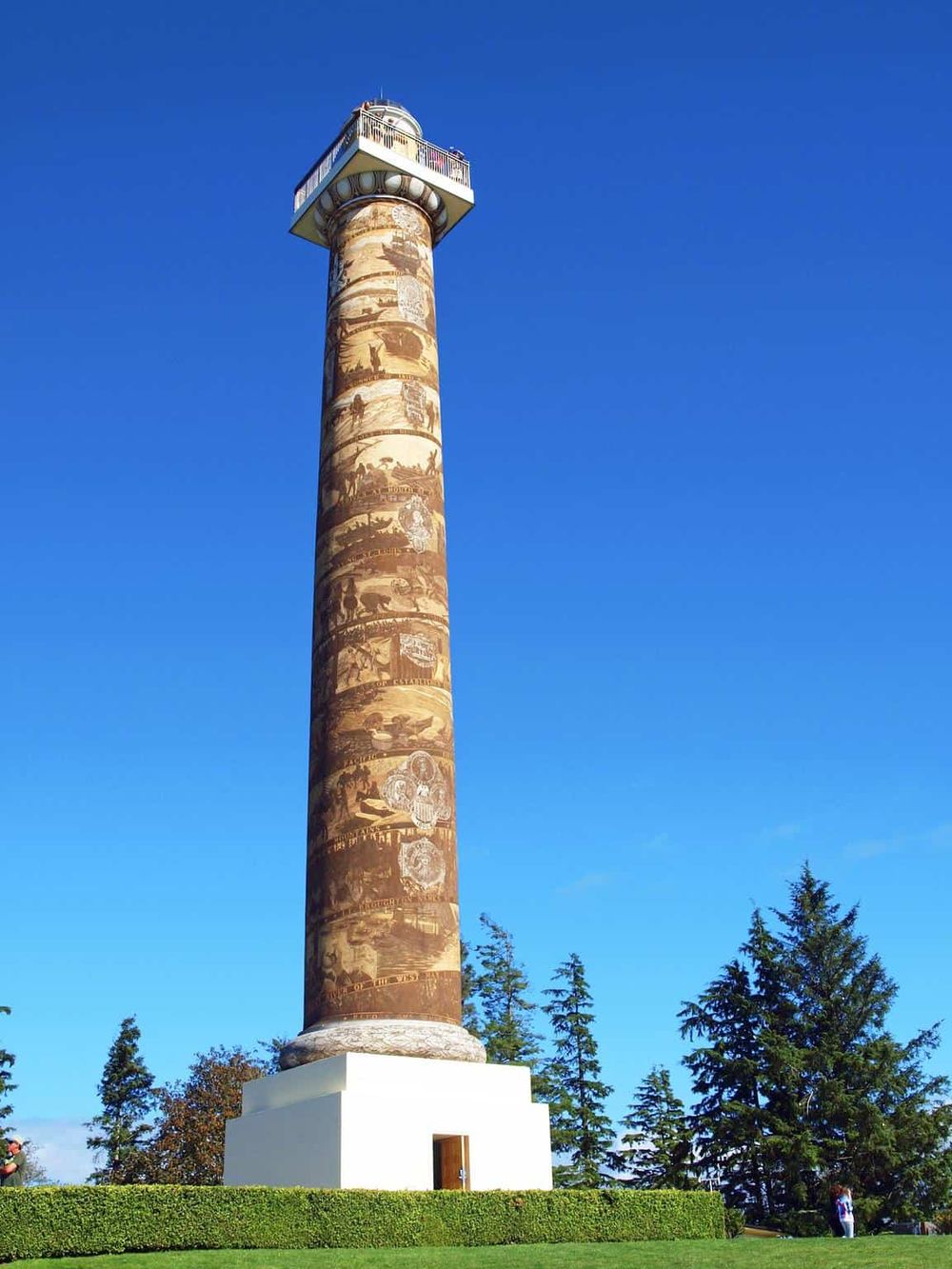 Colorful lighthouse with scenic background, a popular travel destination for navigation and sightseeing.
