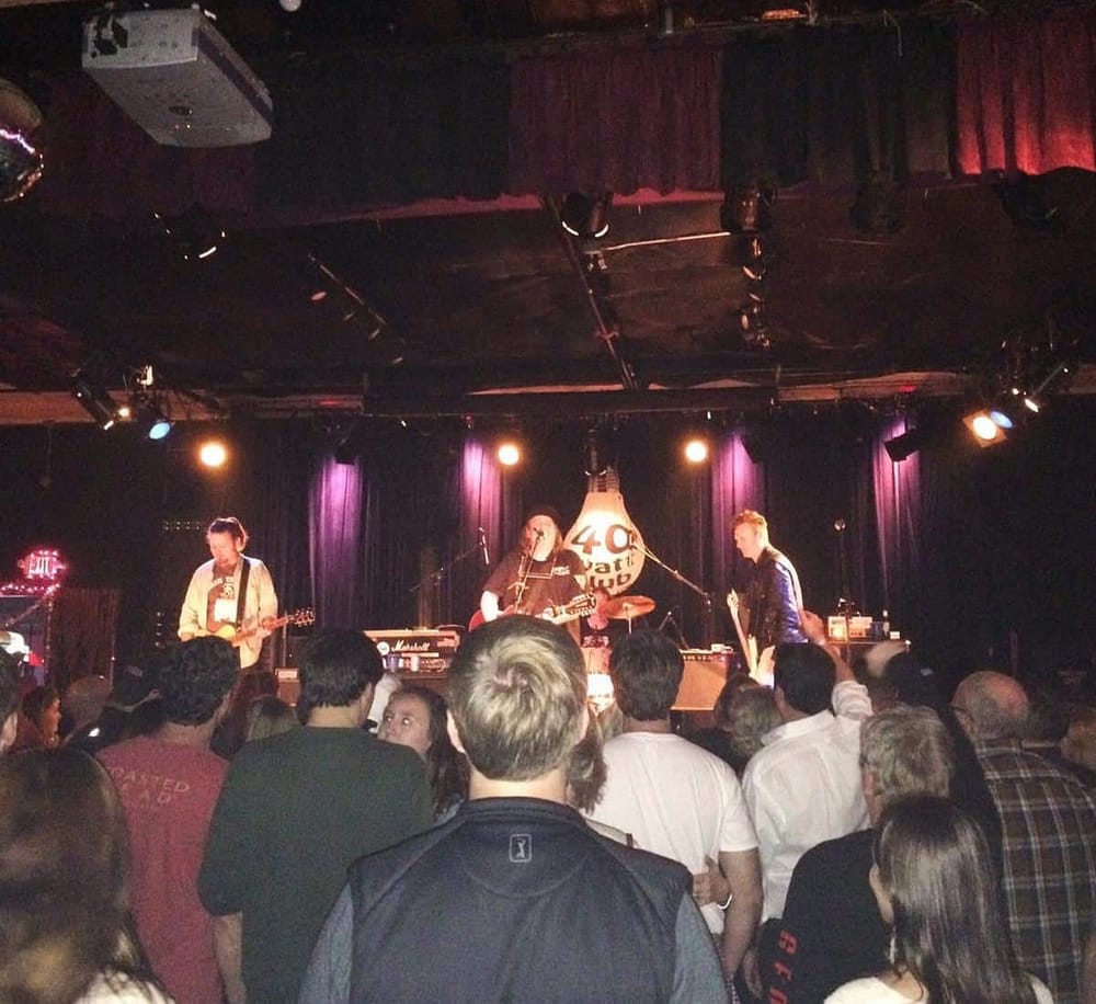 - Live music performance at QuestForDirections concert venue, vibrant stage and audience enjoying the show.