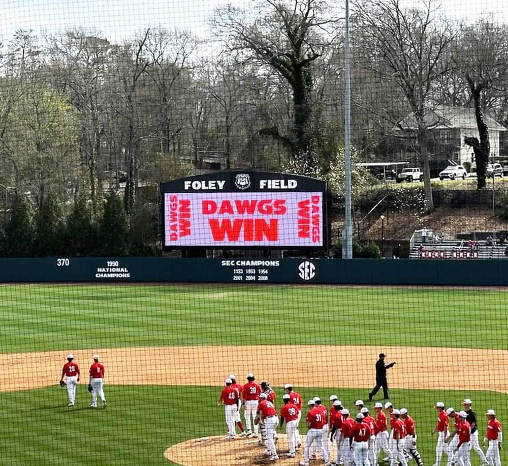 Victory message displayed at Foley Field baseball stadium, celebrating Dawgs winning.