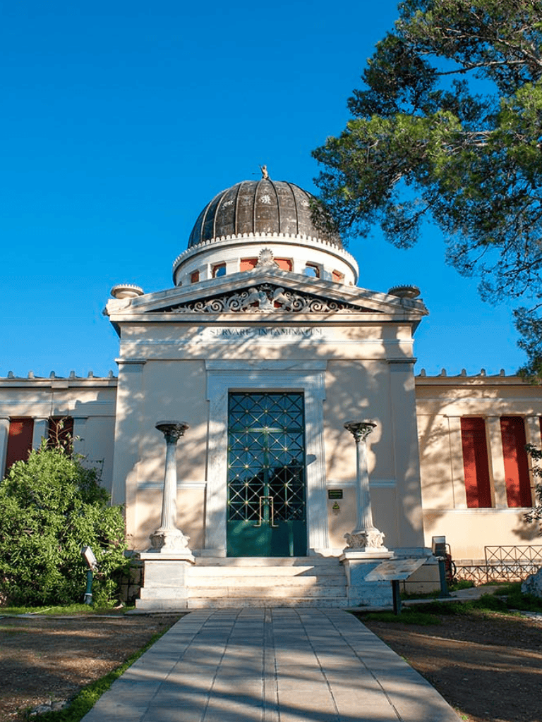 Historic Greek Revival-style building with a domed roof and classical columns, located in QuestForDirections.