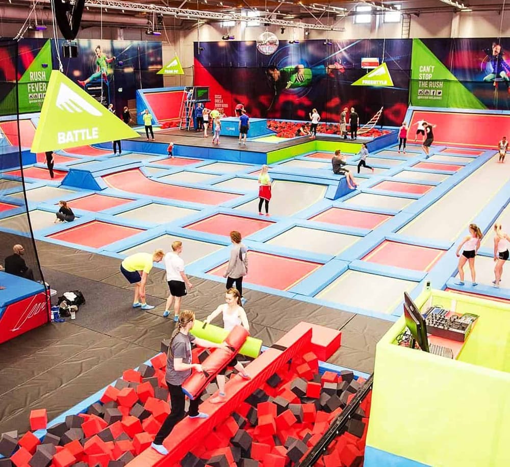 Vibrant indoor trampoline park with various bounce zones and engaging activities for all ages.