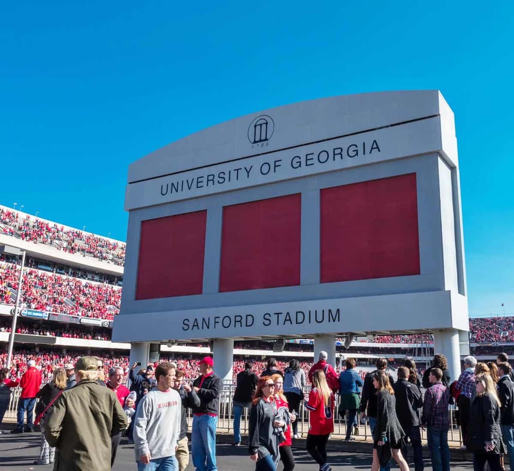 Large university stadium at the University of Georgia, home to Sanford Stadium with sports fans.