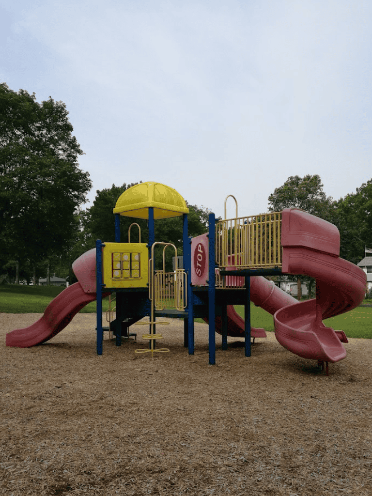 Colorful playground equipment for kids at a community park, ideal for outdoor fun and family activities.