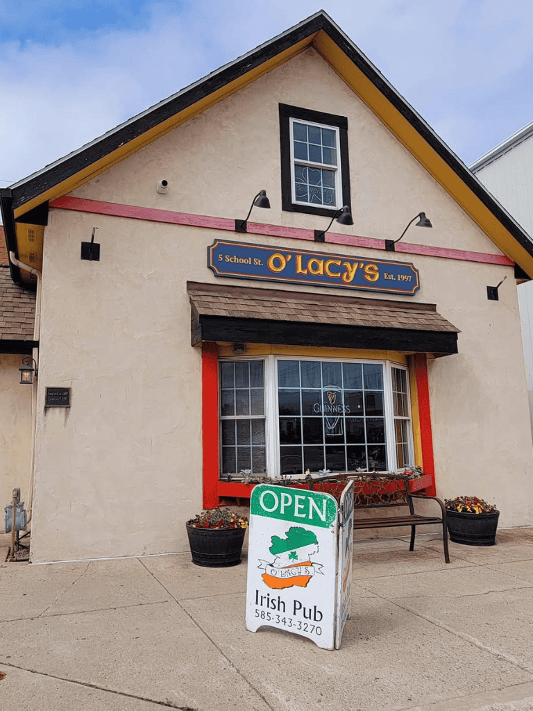 Cozy Irish pub with colorful signage at O' Lacy's, established in 1997, located at 5 School St. in QuestForDirections neighborhood.