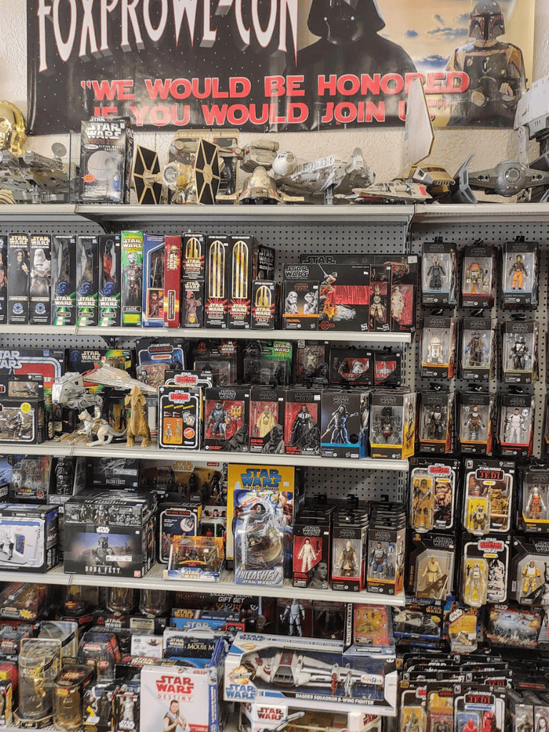 Star Wars collectible action figures and toys on store shelves.