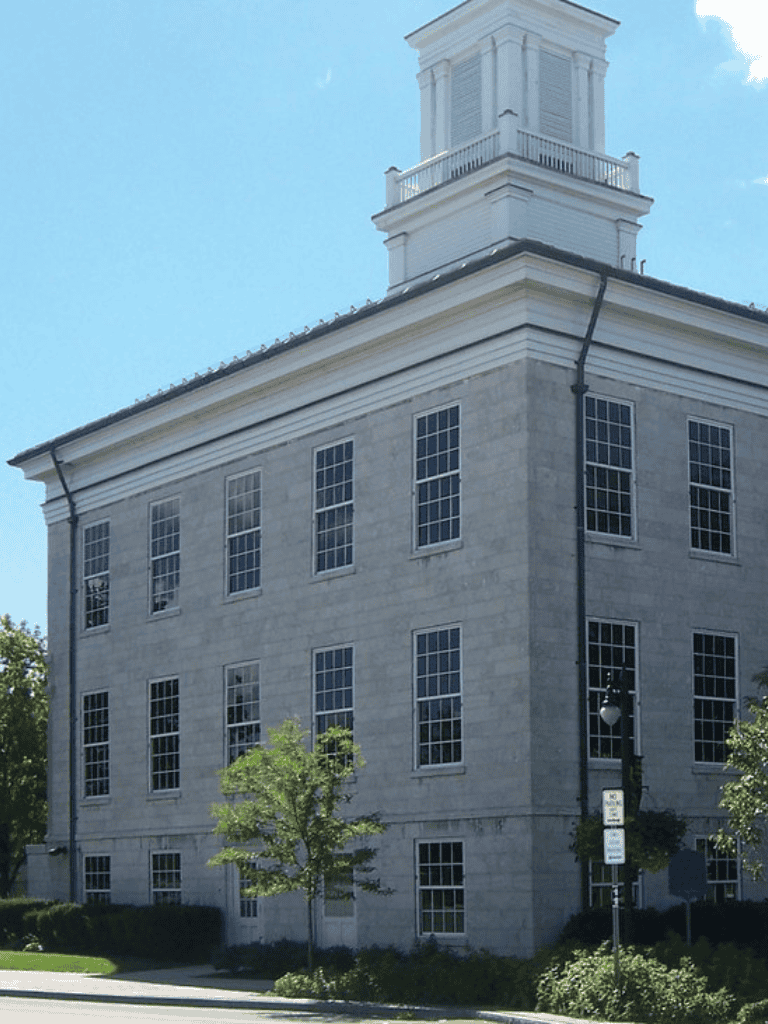 Historic courthouse building exterior with classic architecture and large windows.