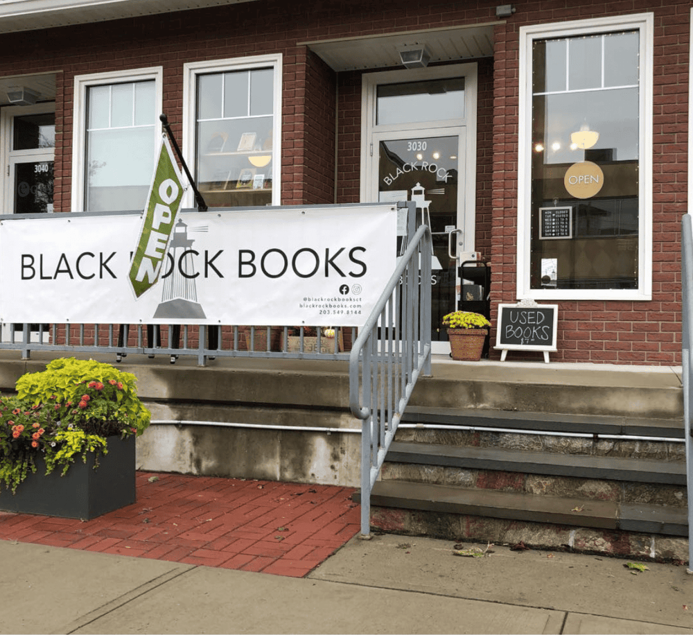 1. Cozy bookstore exterior with "Black Rock Books" signage and outdoor display.