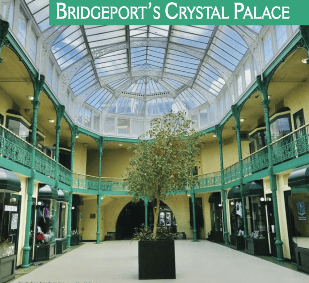Bridgeland’s historic indoor atrium with glass ceiling and green metal accents.