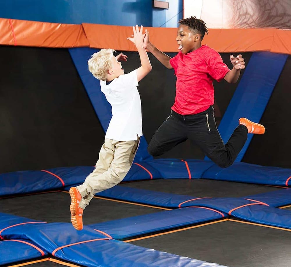 Active kids enjoying trampoline fun at QuestForDirections indoor trampoline park.