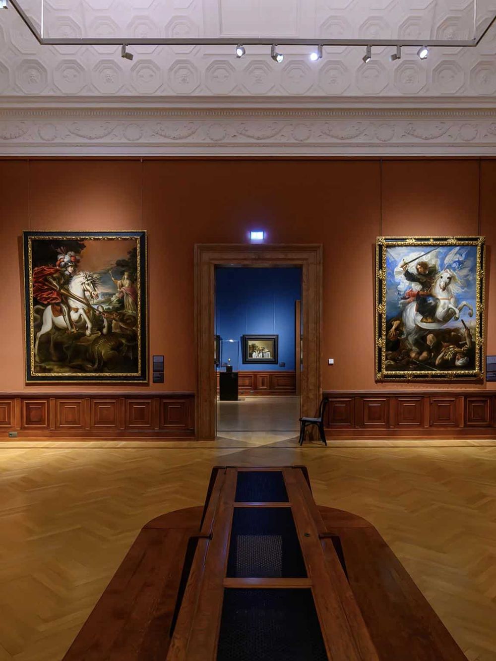 Elegant art gallery featuring classical paintings and ornate architectural details for cultural exploration.