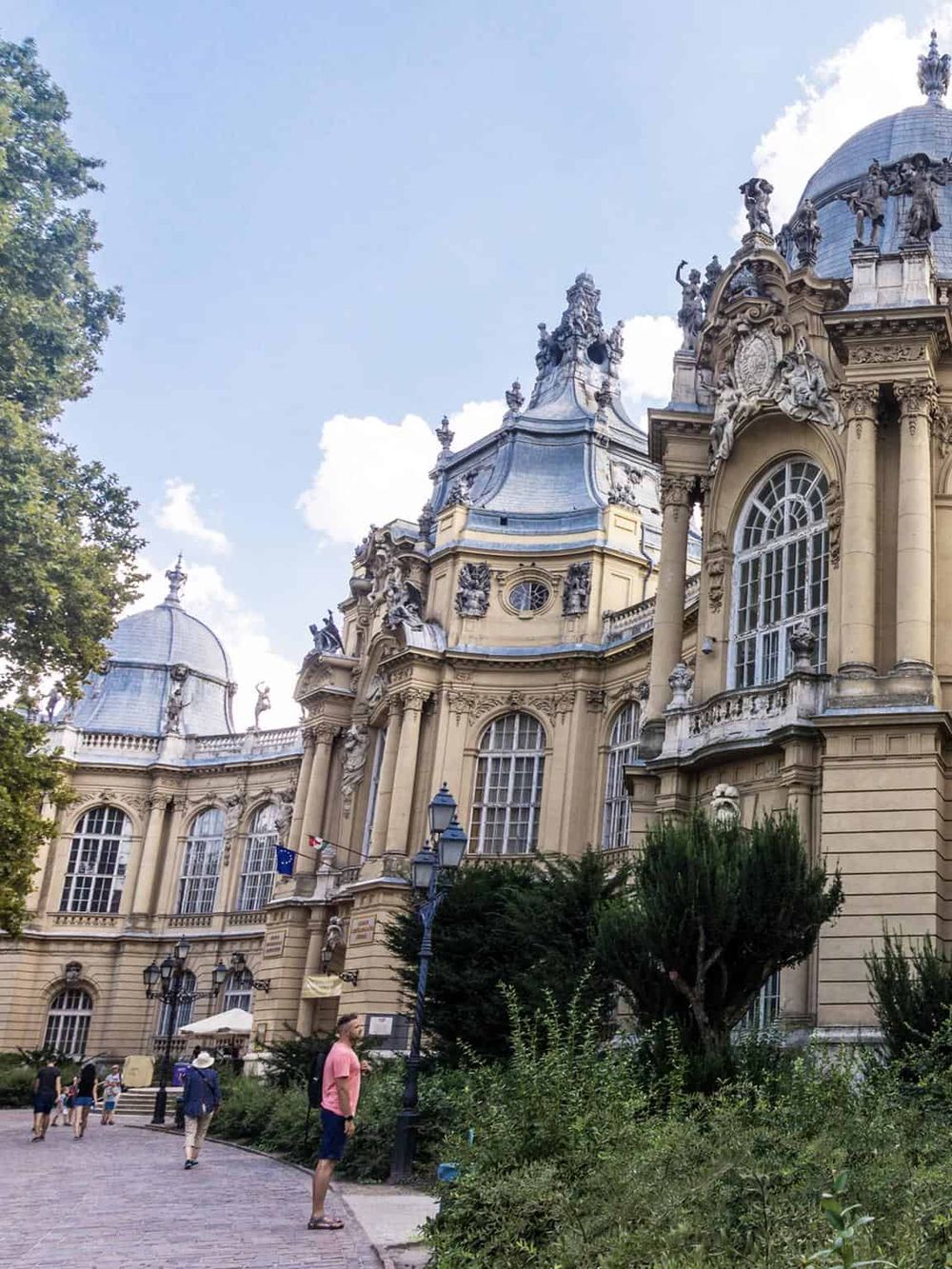 Ornate Baroque church with domed roof and sculptures, popular tourist destination in Vienna, Austria.
