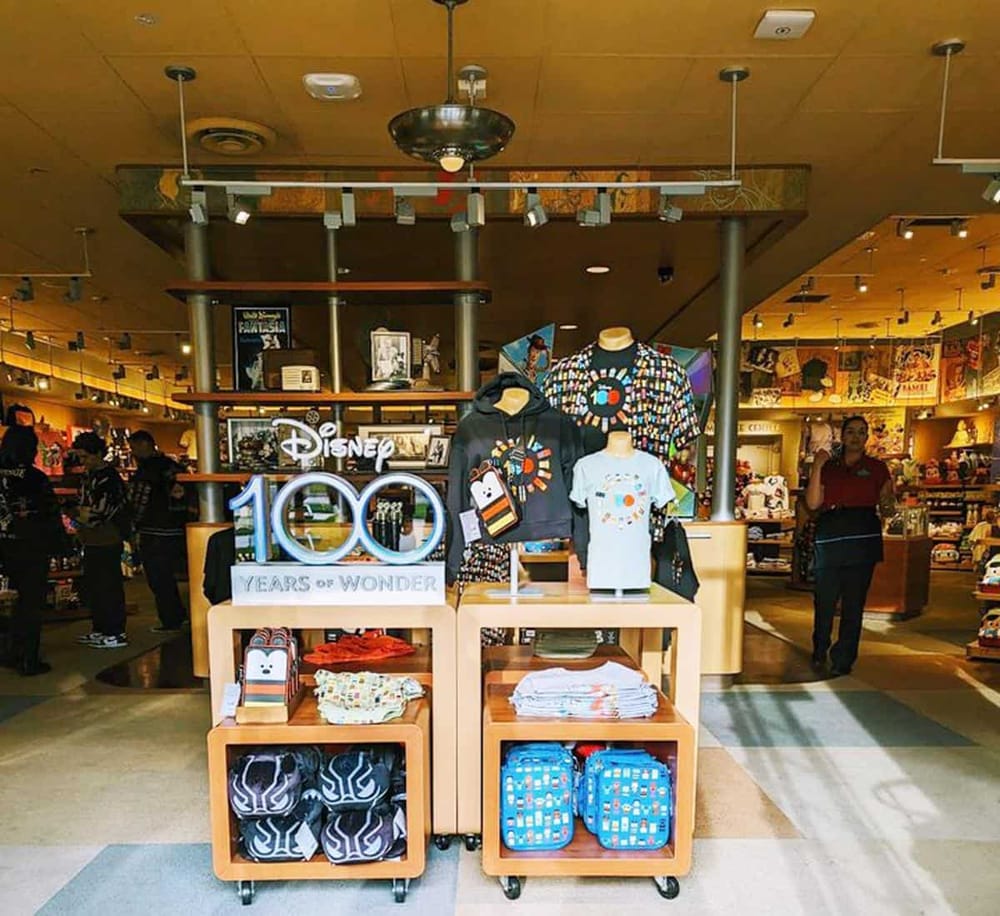 Disney 100 Years of Wonder merchandise display at QuestForDirections store.