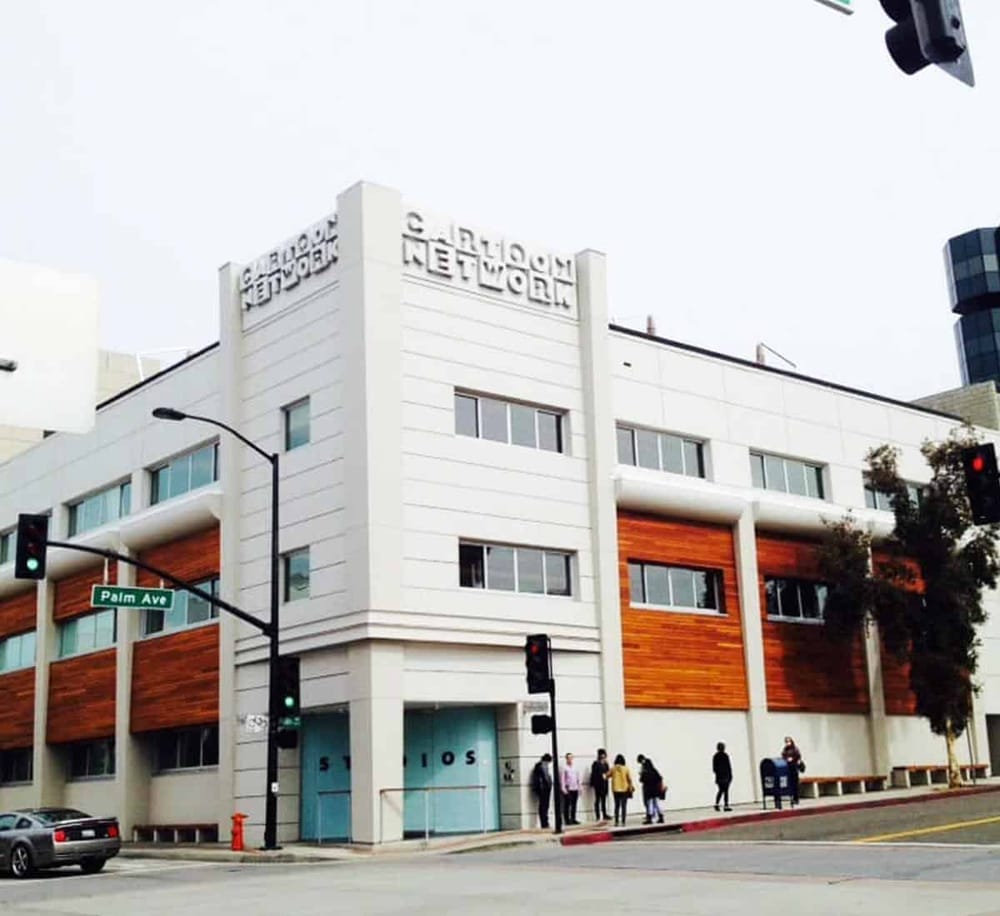 Modern office building with "Clouds Network" signage, location at Palm Ave intersection.