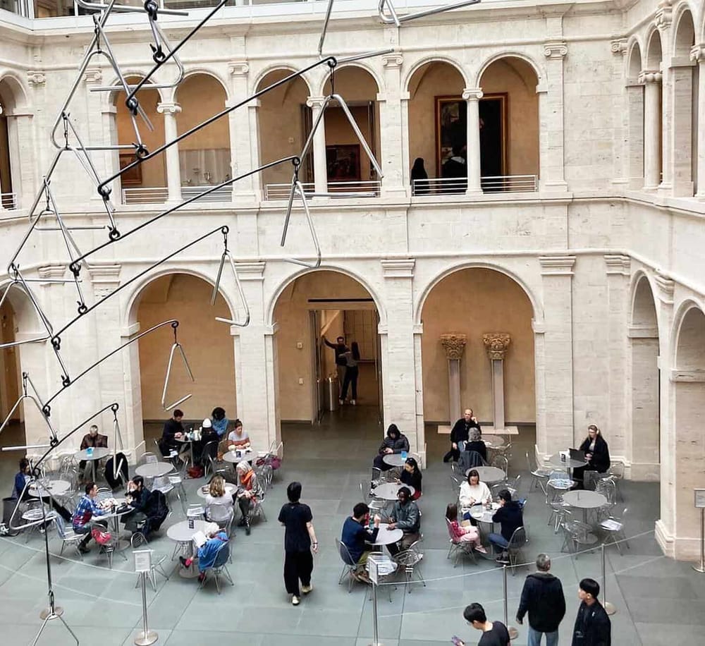 Indoor courtyard at QuestForDirections, offering a modern space with seating for visitors.