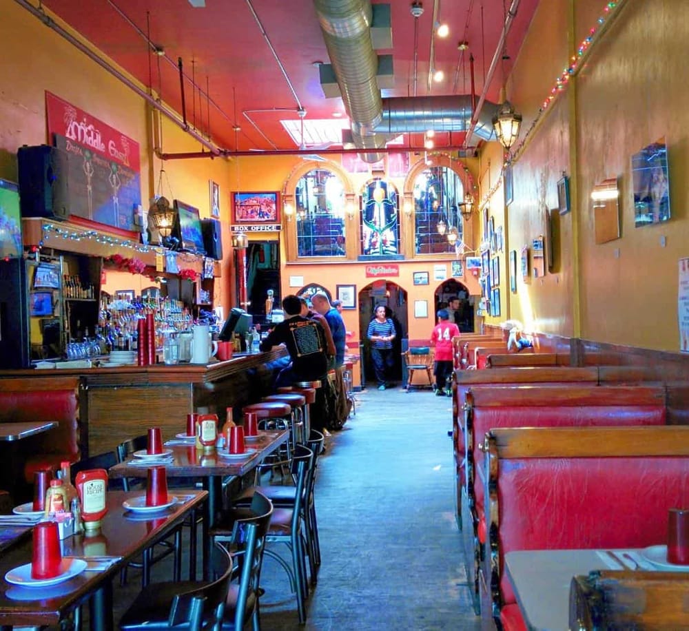 Cozy Mexican restaurant interior with vibrant colors, colorful decor, and casual dining atmosphere.