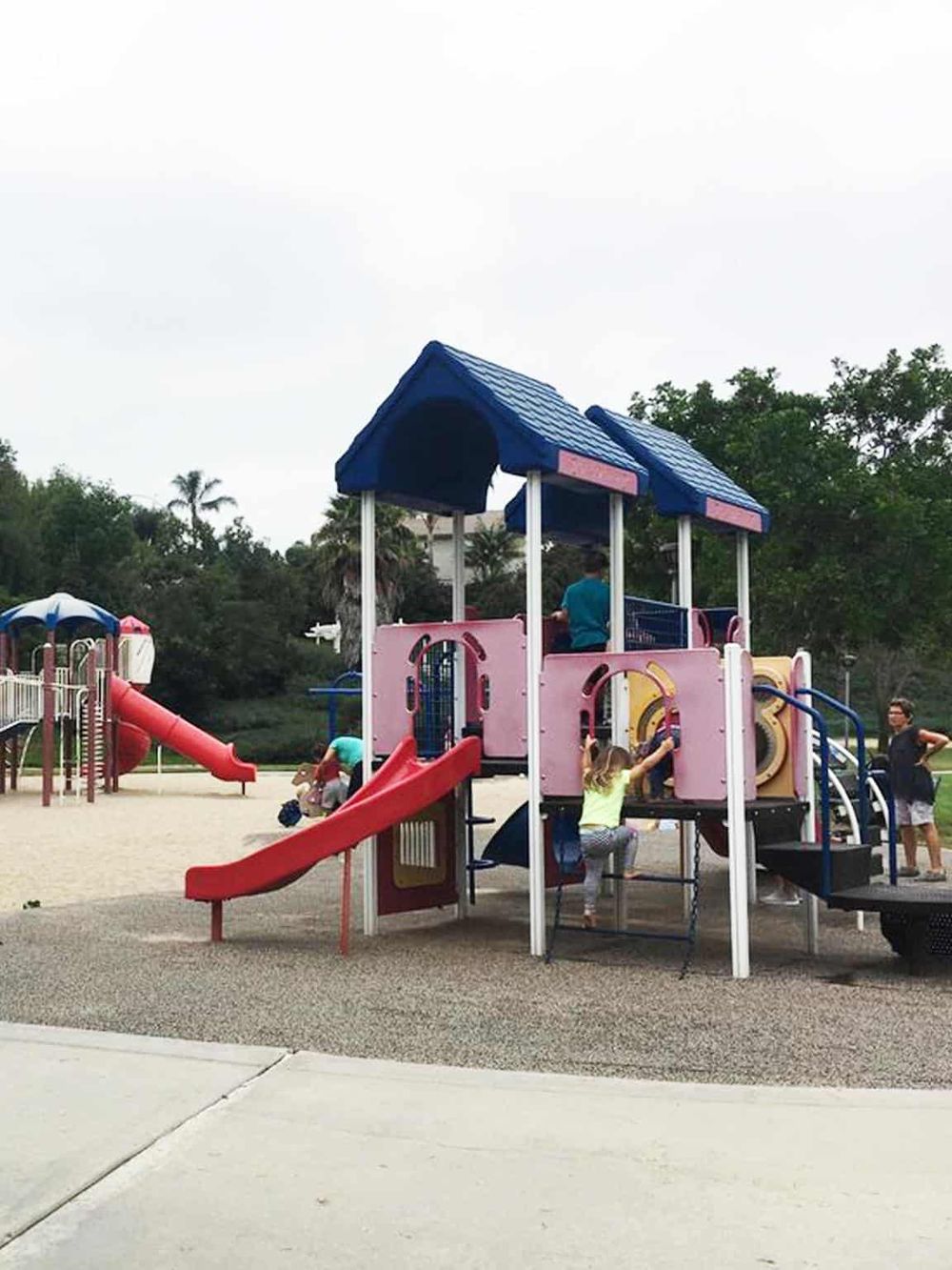 Colorful playground equipment for children at a park focused on family fun and outdoor activities.