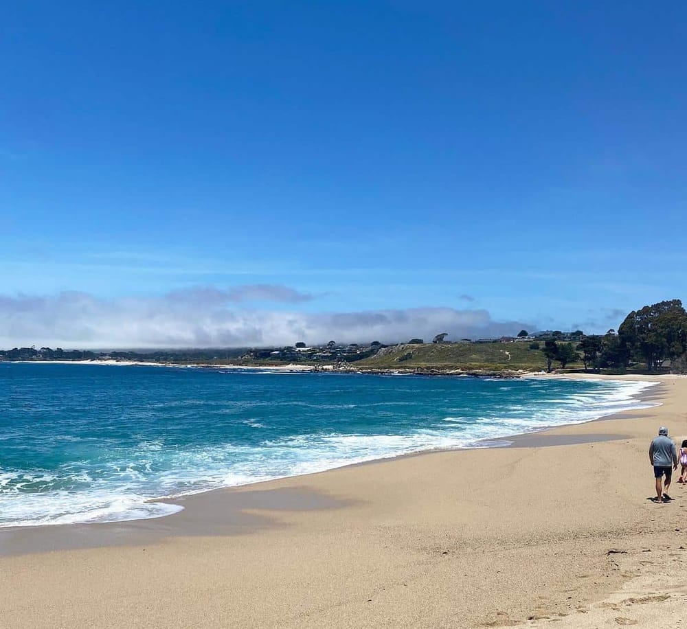 Beautiful beach with blue waters and sandy shore, perfect for seaside relaxation and scenic views.