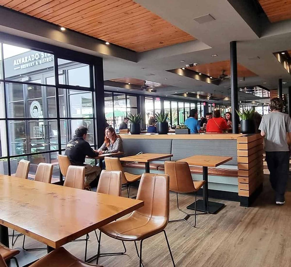 Modern restaurant interior at QuestForDirections, featuring cozy seating and black metal accents.