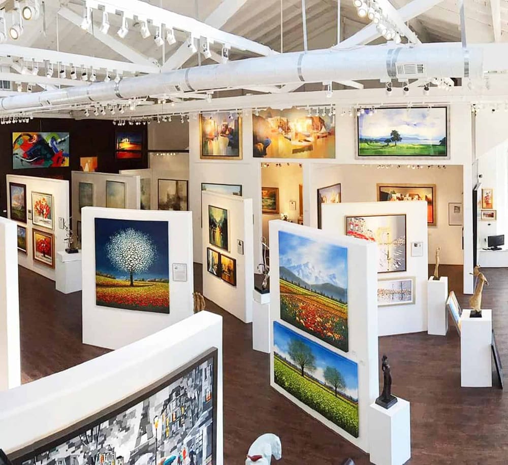 Colorful art gallery showcasing landscape paintings and sculptures at QuestForDirections.